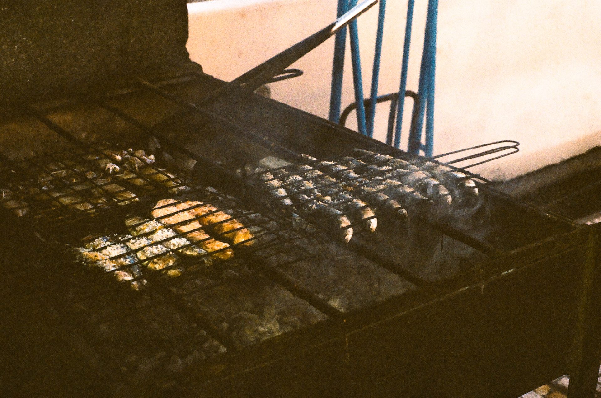 Grilling fish on Sampaio, a fishing village in Vila Nova de Gaia, Portugal