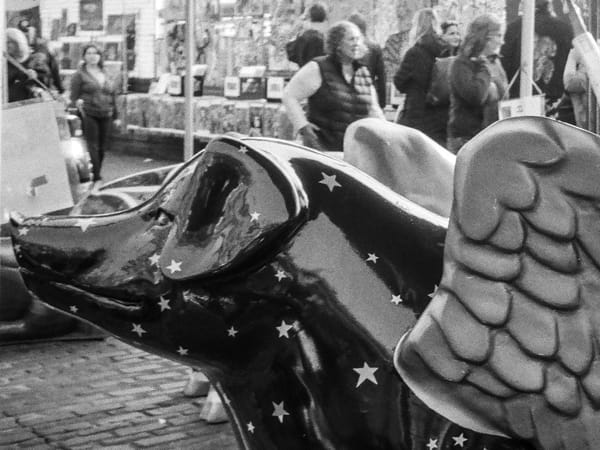 A photo of a pig statue with wings located at Pike Place market in Seattle