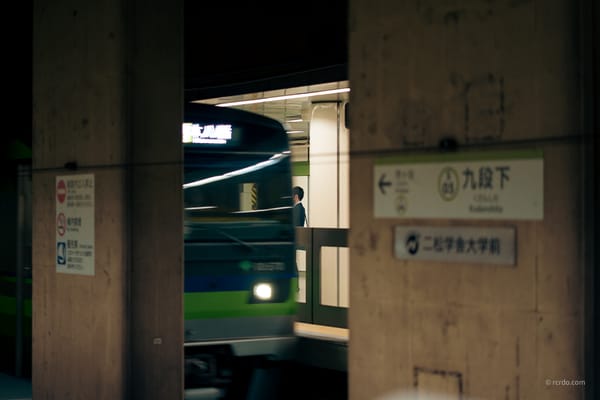 A somewhat faded photo showing a subterranean train passing by