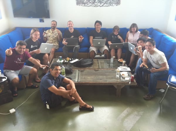 Hackathon team eating pizza